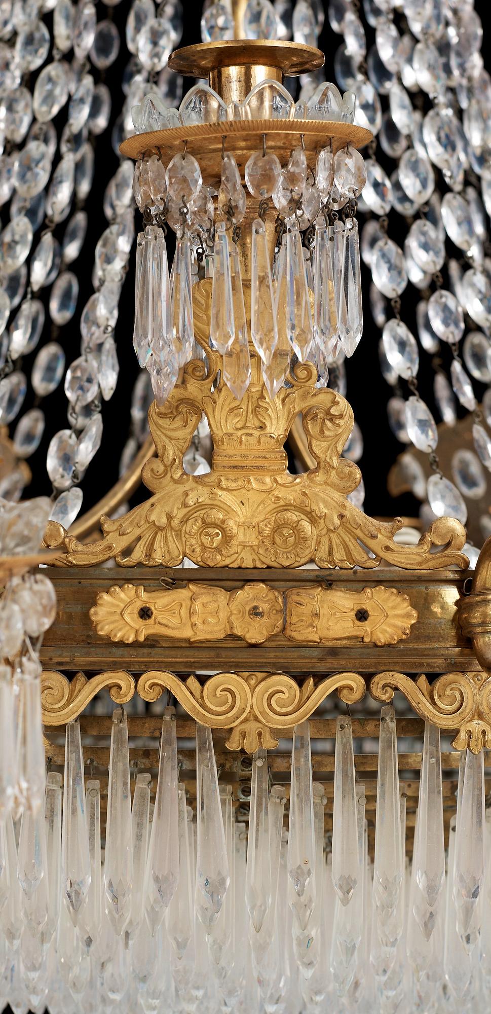 An Empire first half 19th century eighteen-light gilt bronze chandelier.
