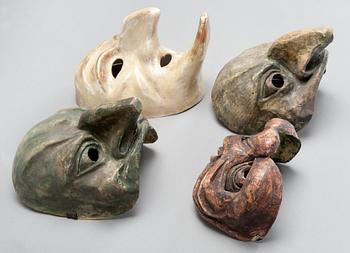 A SET OF FOUR THEATRE MASKS,