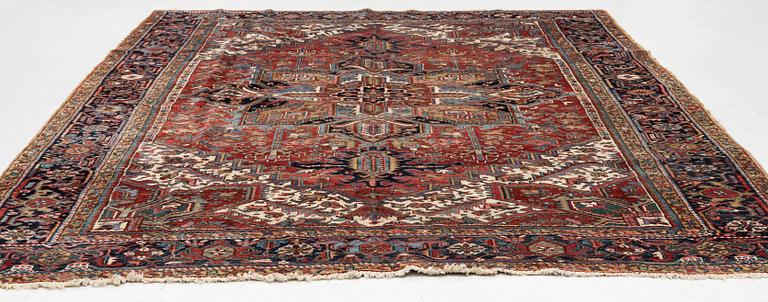 A semi-antique Heris carpet, west persia c. 322 x 252 cm.
