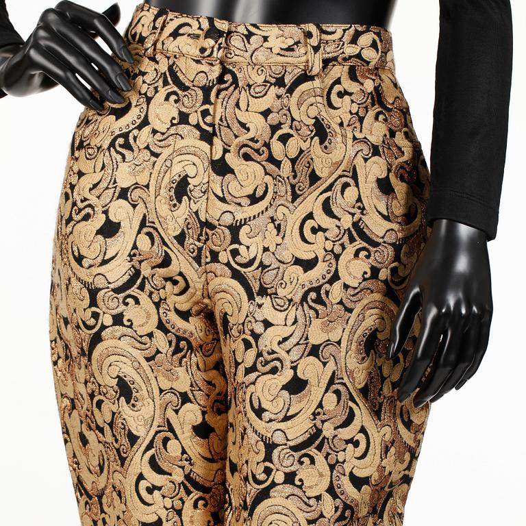 OZBEK, a polo-neck sweater and trousers.