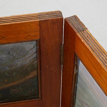 A folding screen, late 19th century.