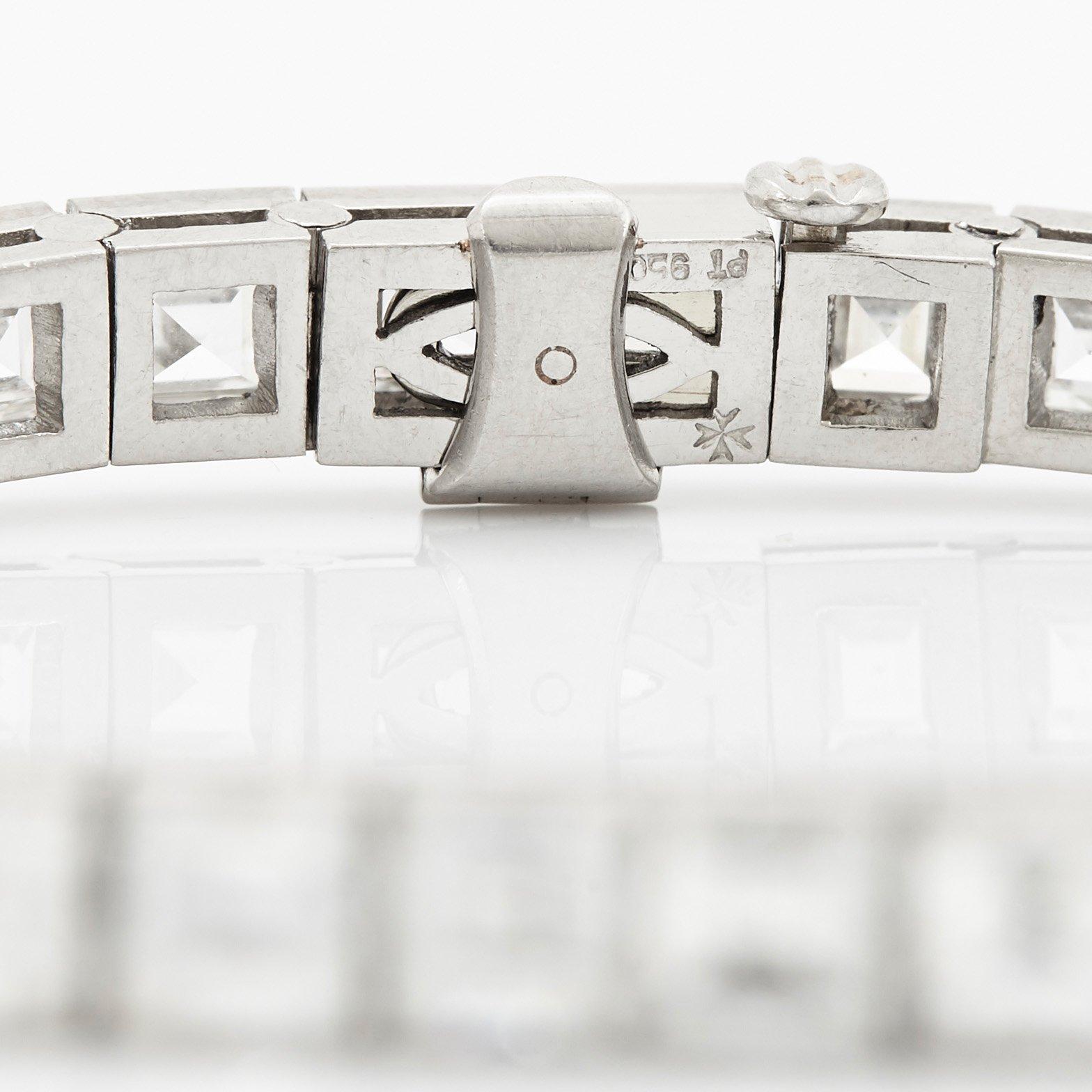 A platinum bracelet set with carré cut diamonds.