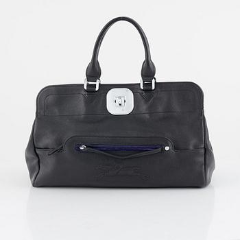 Longchamp, A black leather bag.