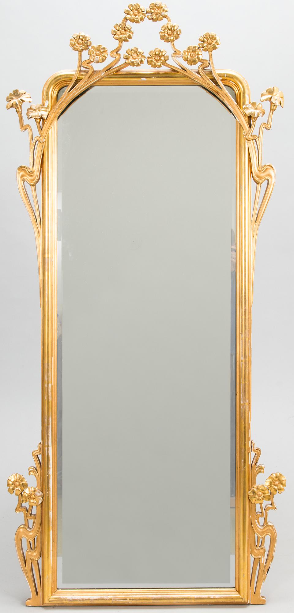 An Art Nouveau mirror with console table from early 20th century.