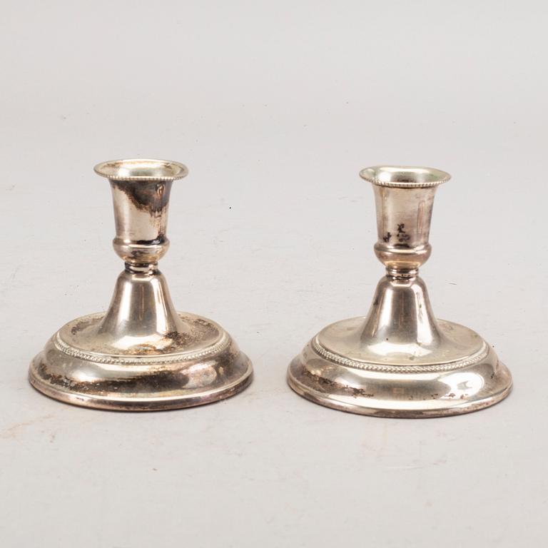 A set of three pair of Swedish 20th century silver candle sticks.