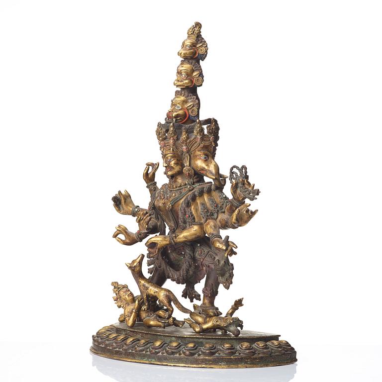 A large Tibetan eight armed deity, probably 20th Century.