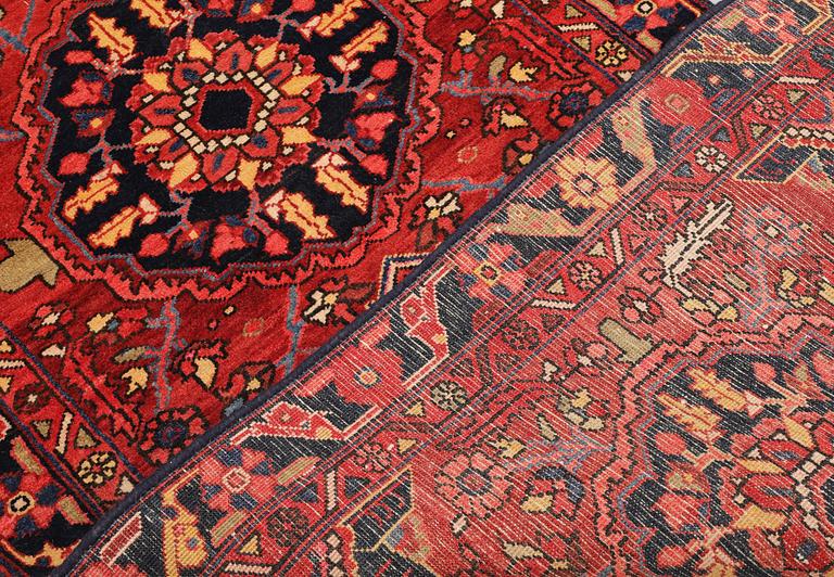 A semi-antique Heriz runner, c. 340 x 92 cm.