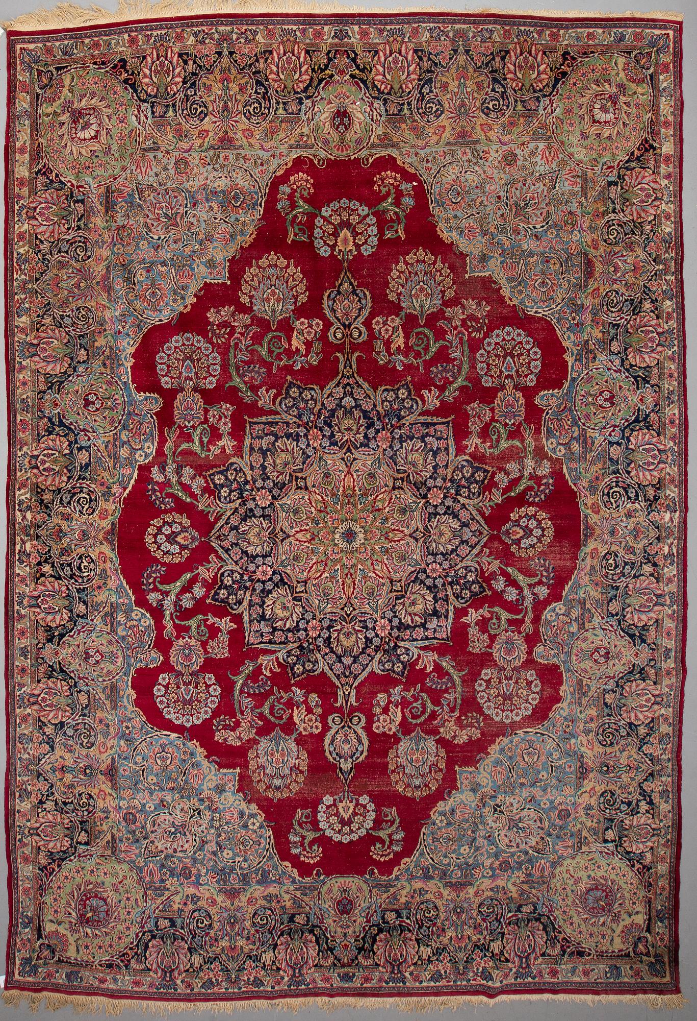 A CARPET, , semi-antique Kerman, ca 431 x 296 cm.