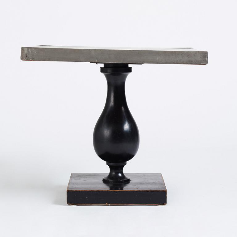 Uno Åhrén, a black lacquered table with a pewter top by Nils Fougstedt, Svenskt Tenn ca 1930. Alva & Gunnar Myrdal Collection.