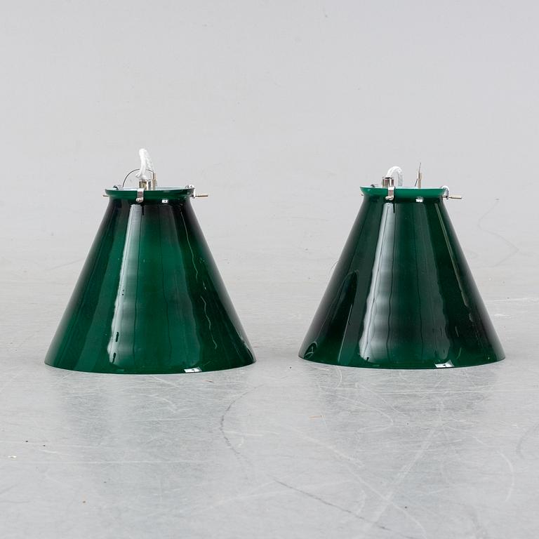 A pair of ceiling lamps in green and white glass, model no 4011, Zero.