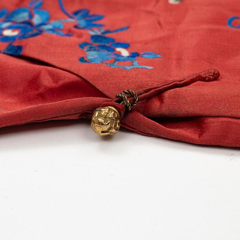 A Chinese semi-formal embroidered silk robe, late Qing dynasty, circa 1900.