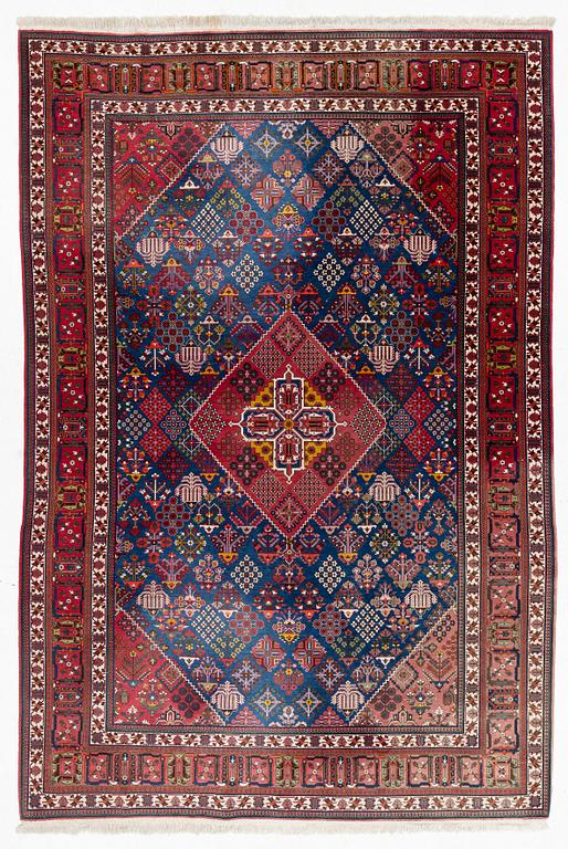 An oriental carpet, c. 360 x 240 cm.