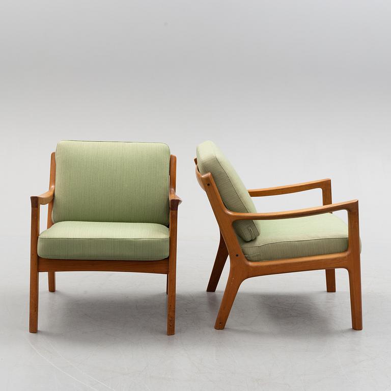 A pair of Ole Wanscher 'Senator' teak easy chairs, for France & Son, Denmark, second half of the 20th century.