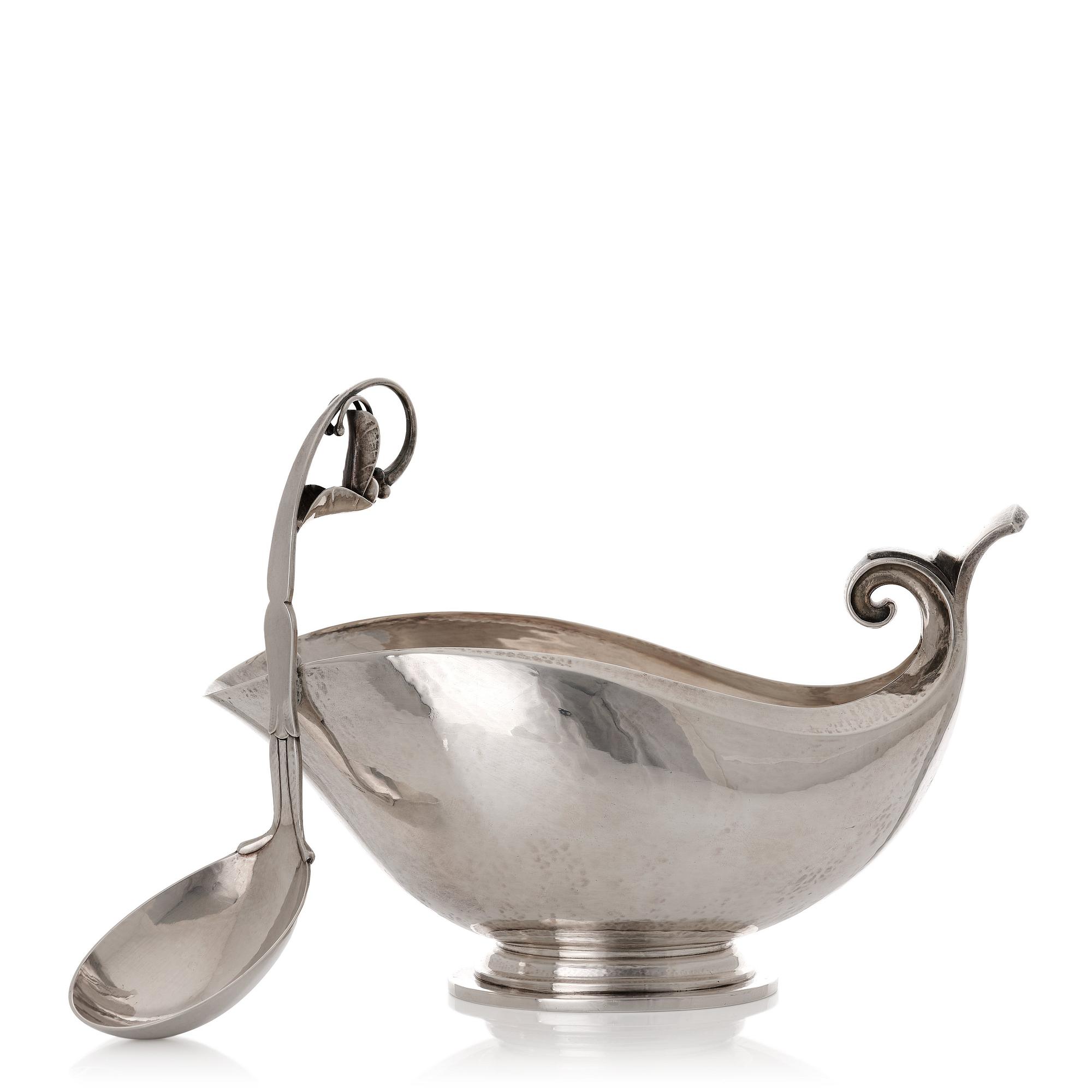Georg Jensen, a sterling silver sauceboat and ladle, Copenhagen 1925-1945, design nr 98 and 141.