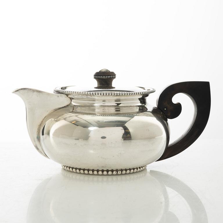 An Italian silver teapot, cream jug and sugar bowl, 20th century.