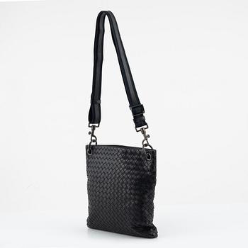 Bottega Veneta, a black intrecciato leather bag.