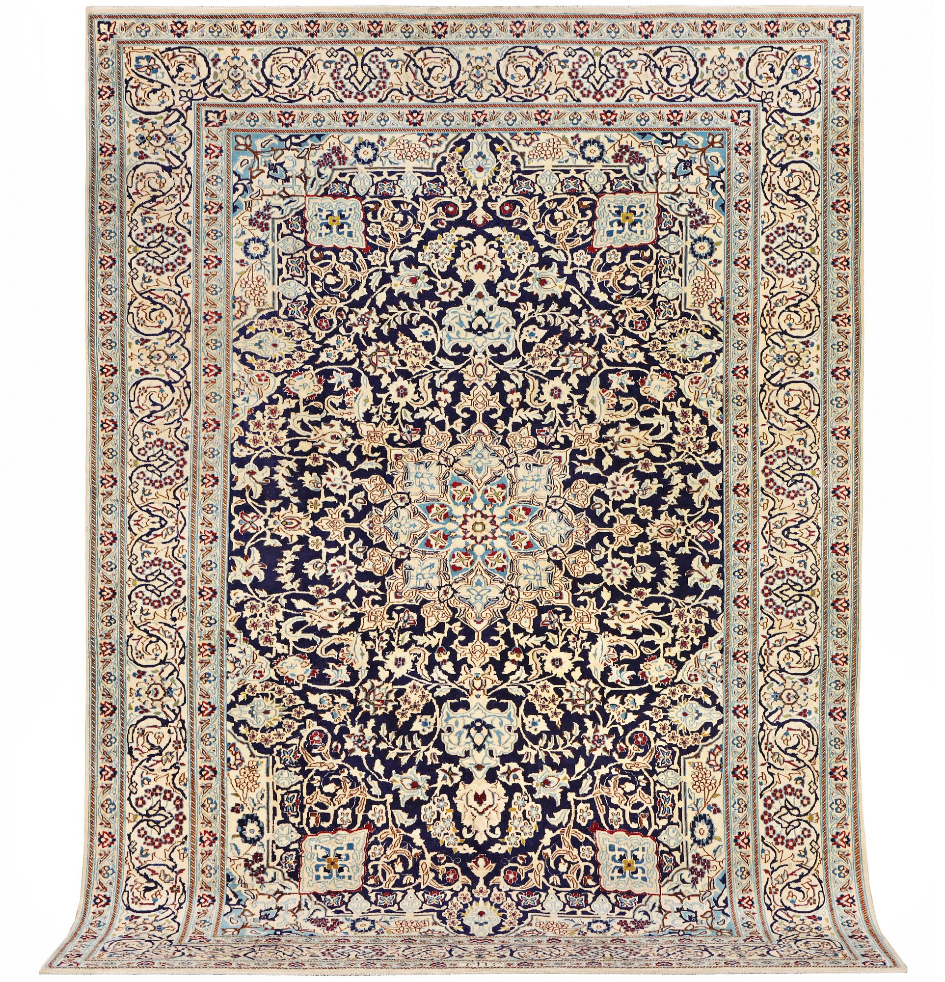 A Nain carpet, part silk, c. 338 x 244 cm.