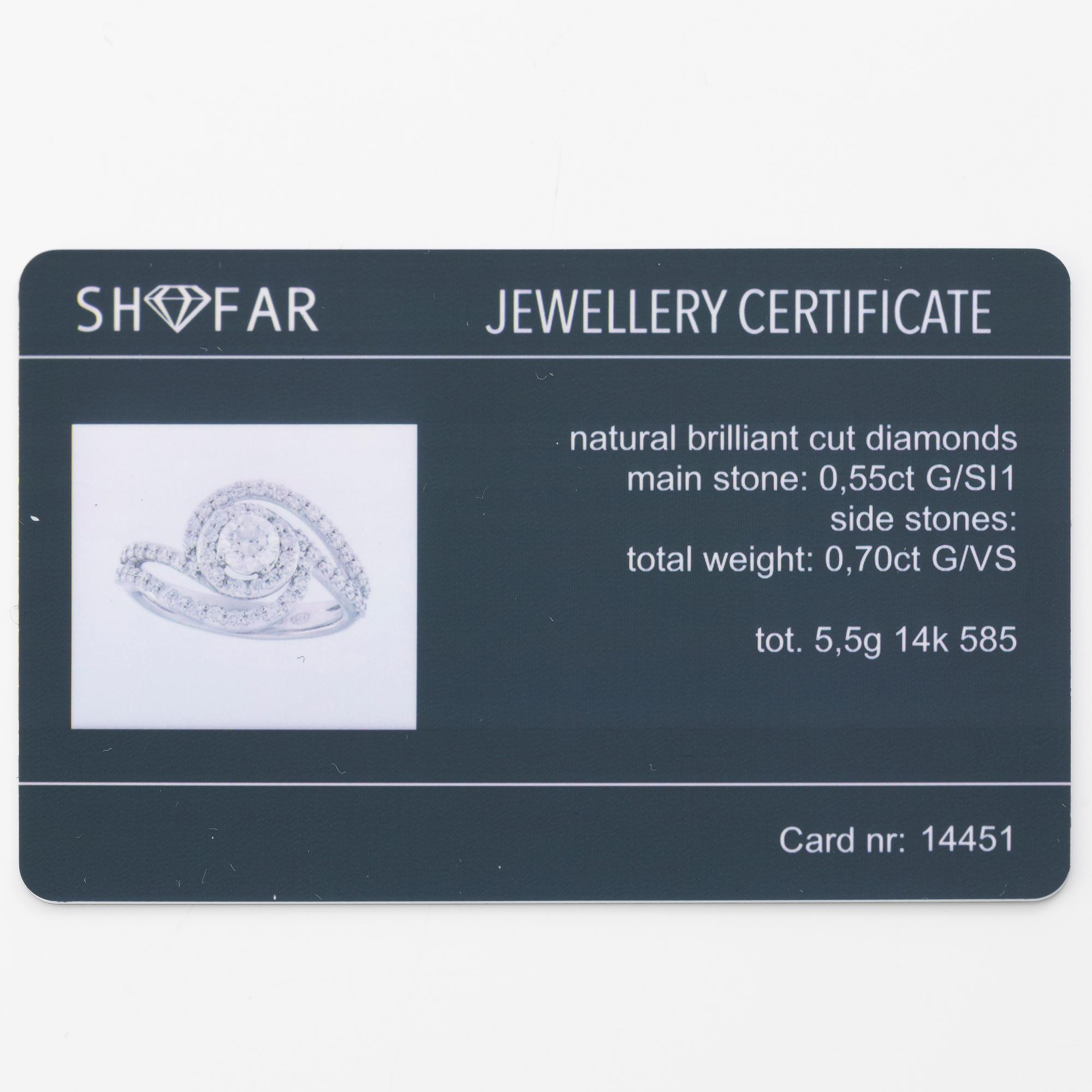 Ring 14K white gold set with round brilliant-cut diamonds.