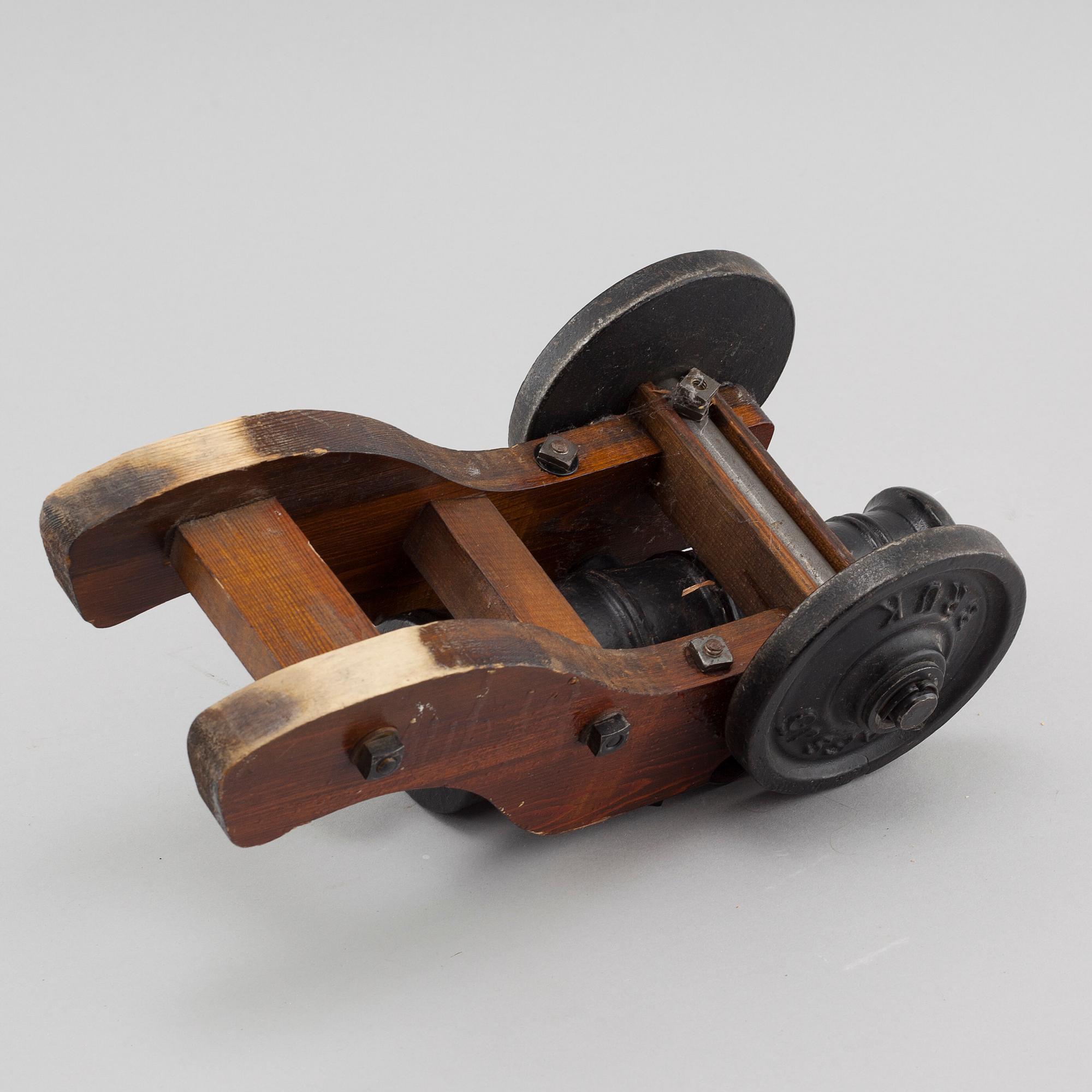 A 20th century salute cannon with wooden gun carriage by Stafsjö Bruk, Sweden.