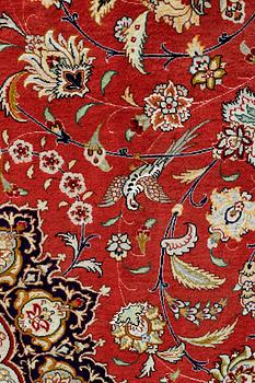 A carpet, Täbriz part silk, 341 x 248 cm.