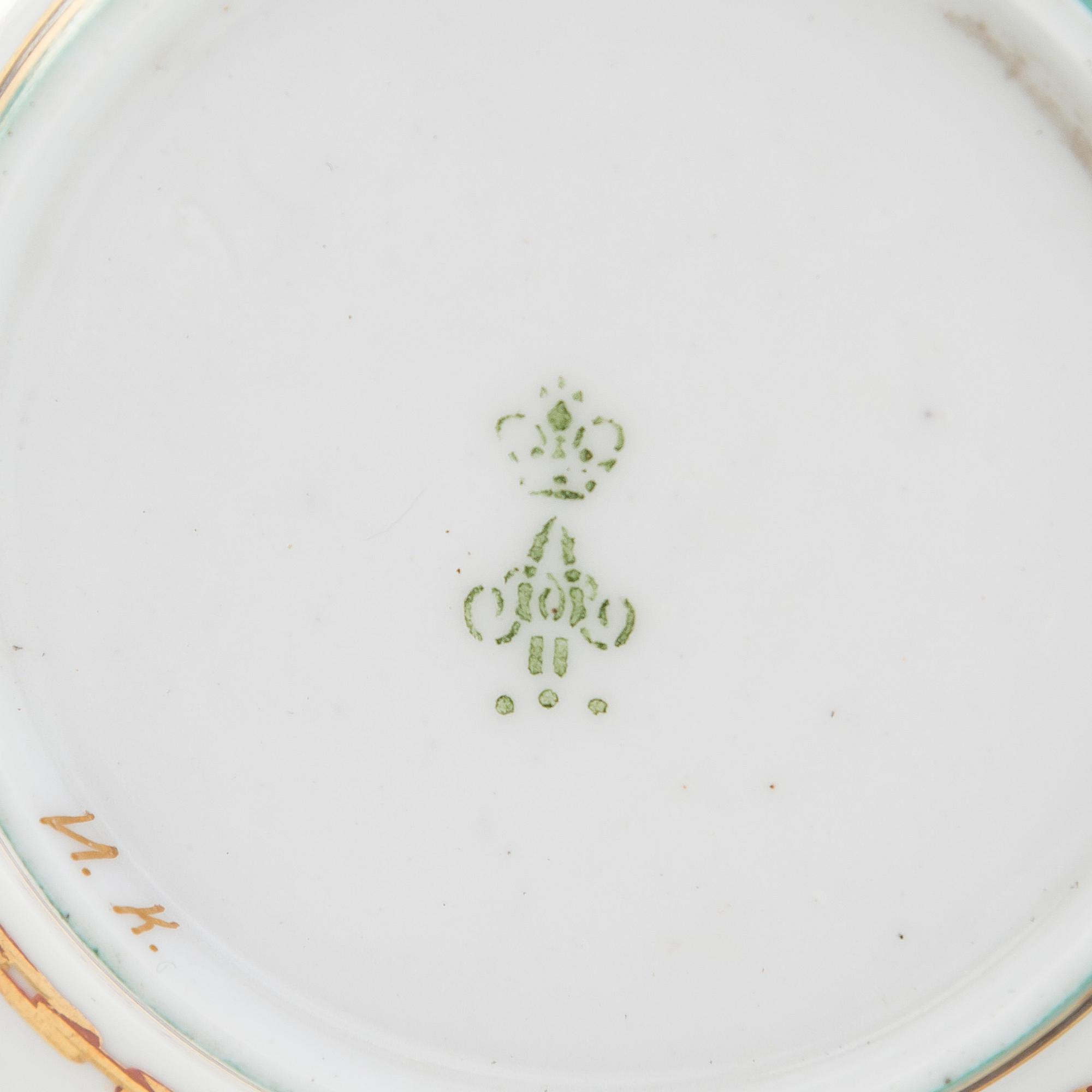 A cup and saucer from the Derzhava service, Imperial Porcelain Manufactory, St. Petersburg, late 19th century.