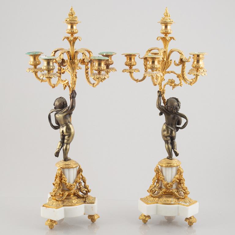 A pair of bronze and marble candelabra, possibly France, late 19th century.