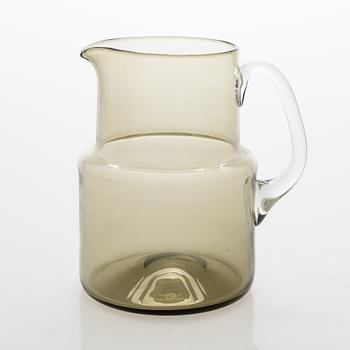 Saara Hopea, A glass pitcher and six glasses in rattan basket, for Nuutajärvi. Designed year 1952.