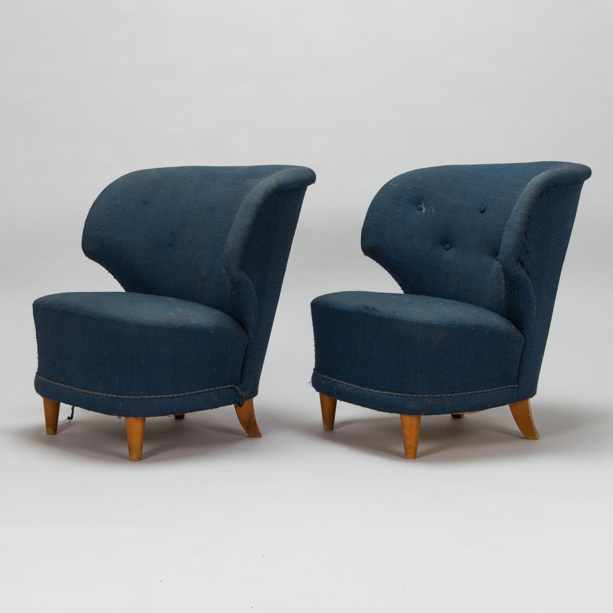 A pair of 1950s armchairs.