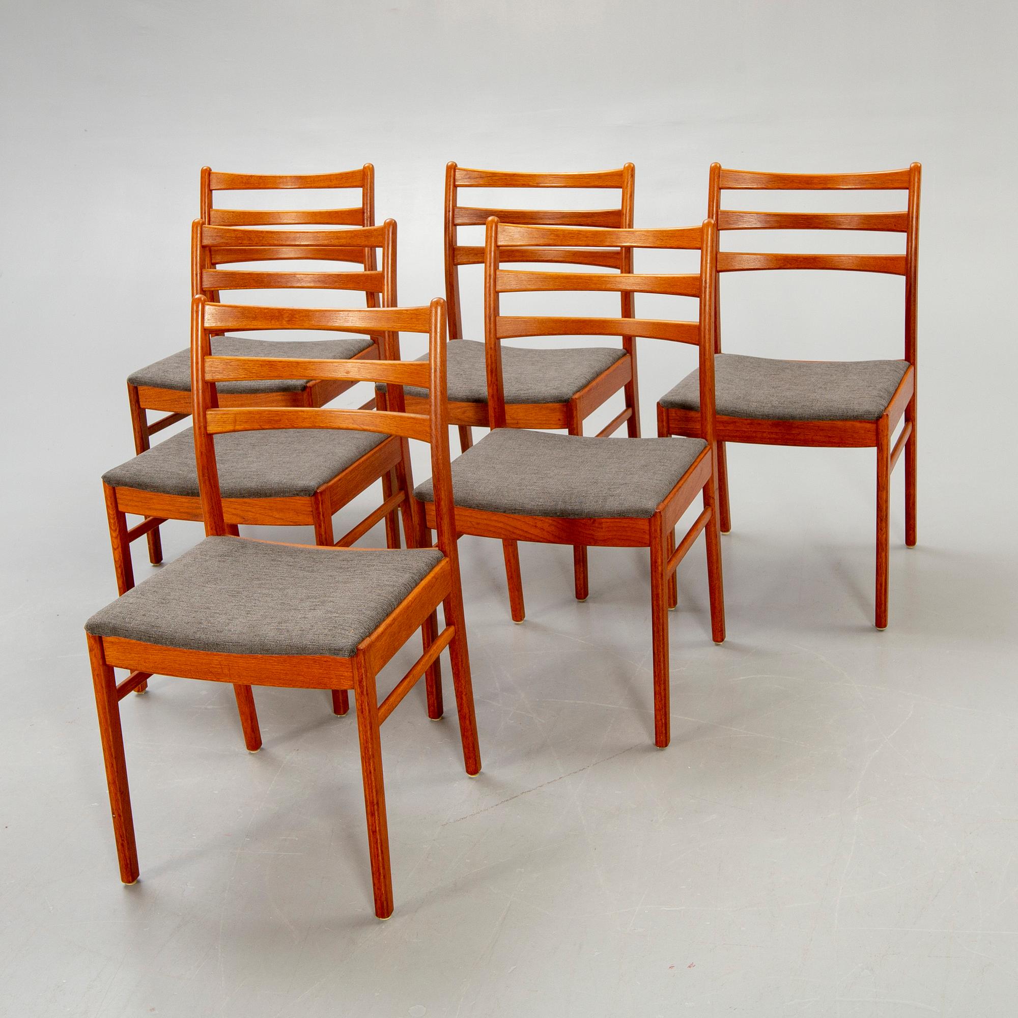 A set of six t1960s teak dining chairs.