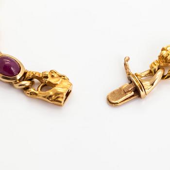 Carrera y Carrera, an 18K gold bracelet, in the shape of panthers with cabochon-cut rubies.