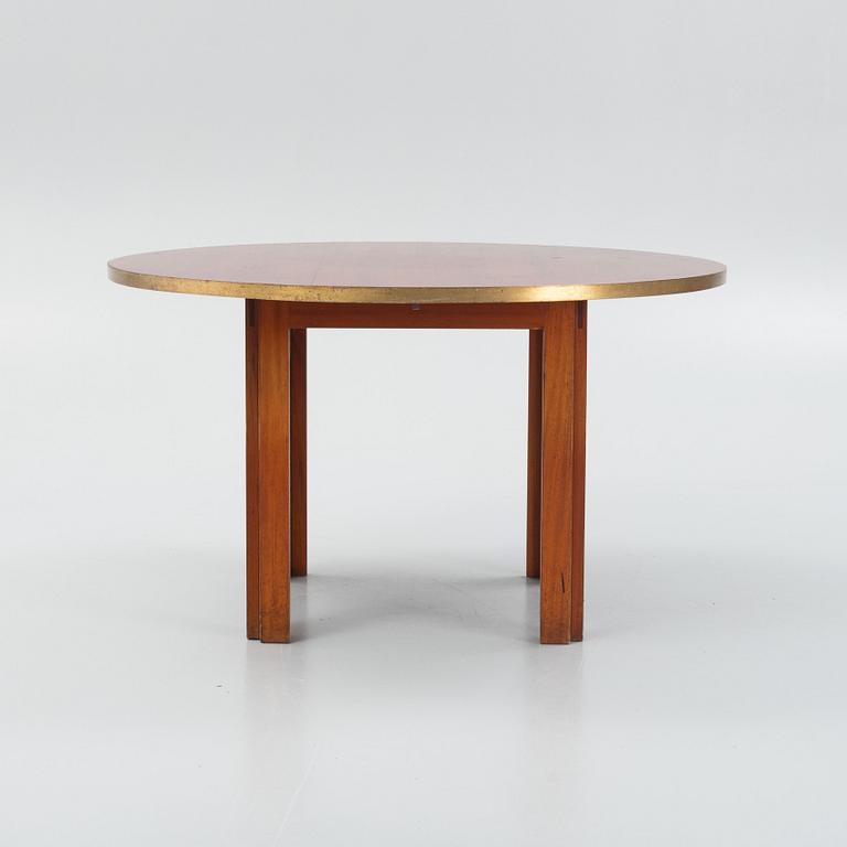 A mid 20th century dining table.