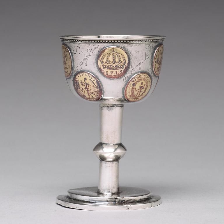 A Swedish 18th century parcel-gilt silver tumbler / cup, with copper coins, unmarked.