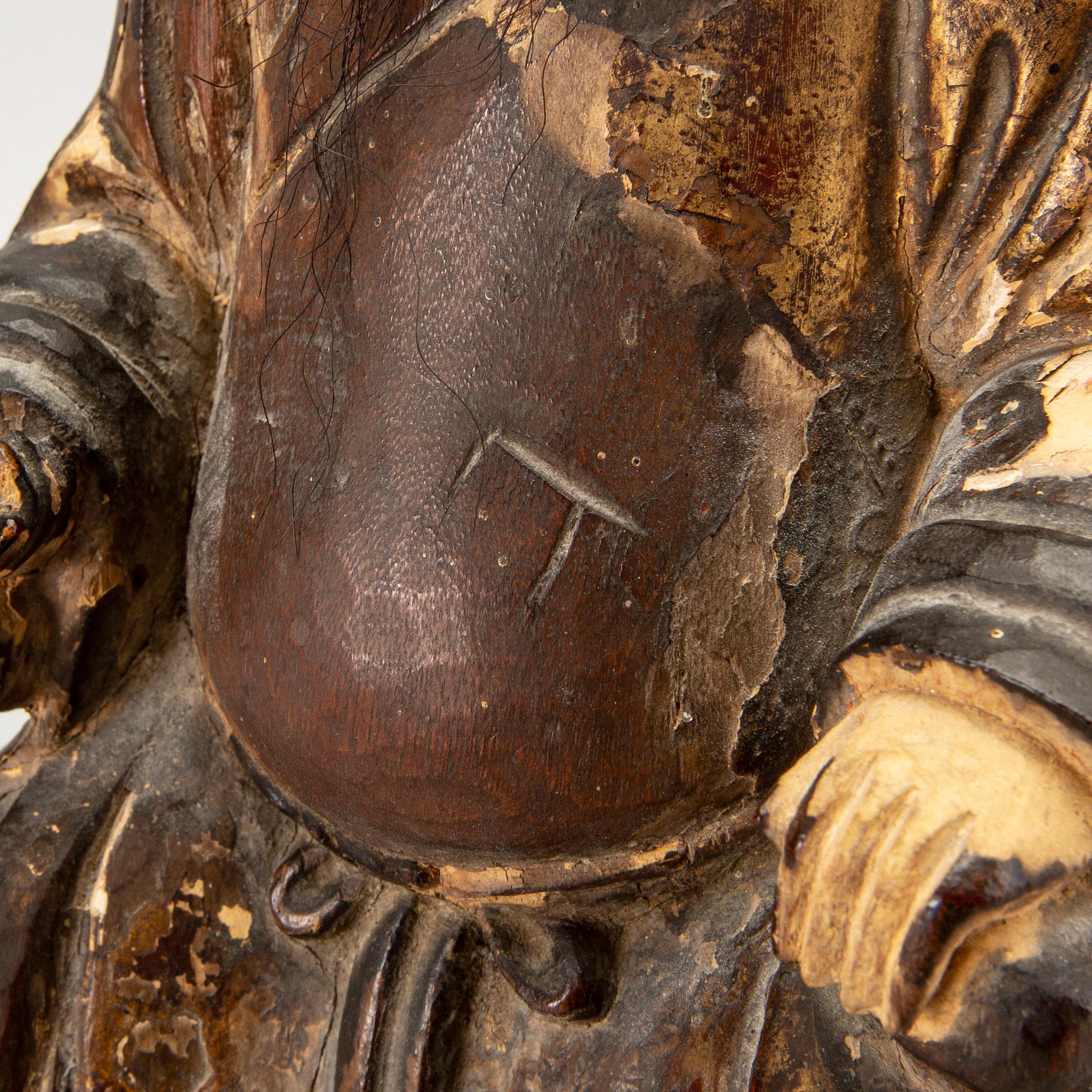 A Chinese late Qing painted wooden sculpture.