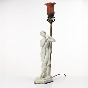 A table lamp, parian and brass, 1916.