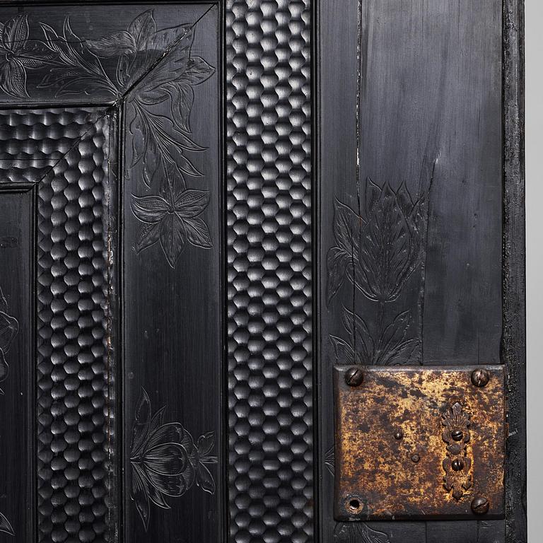 A Louis XIV and Louis XIV-style carved ebony, ivory and tortoiseshell-inlaid cabinet on stand, 17th and 19th century.