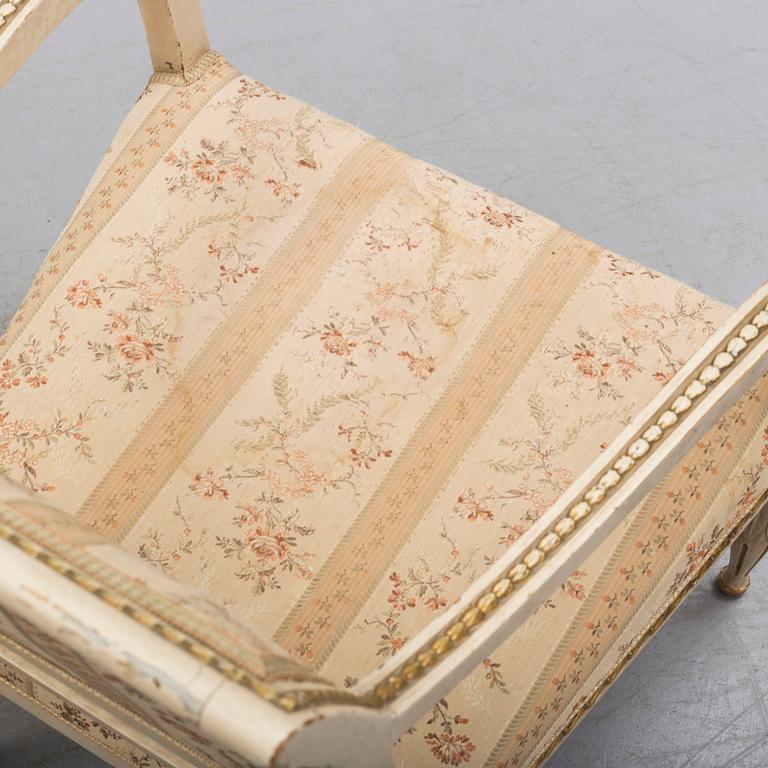 A pair of first half of the 19th century Empire arm chairs.