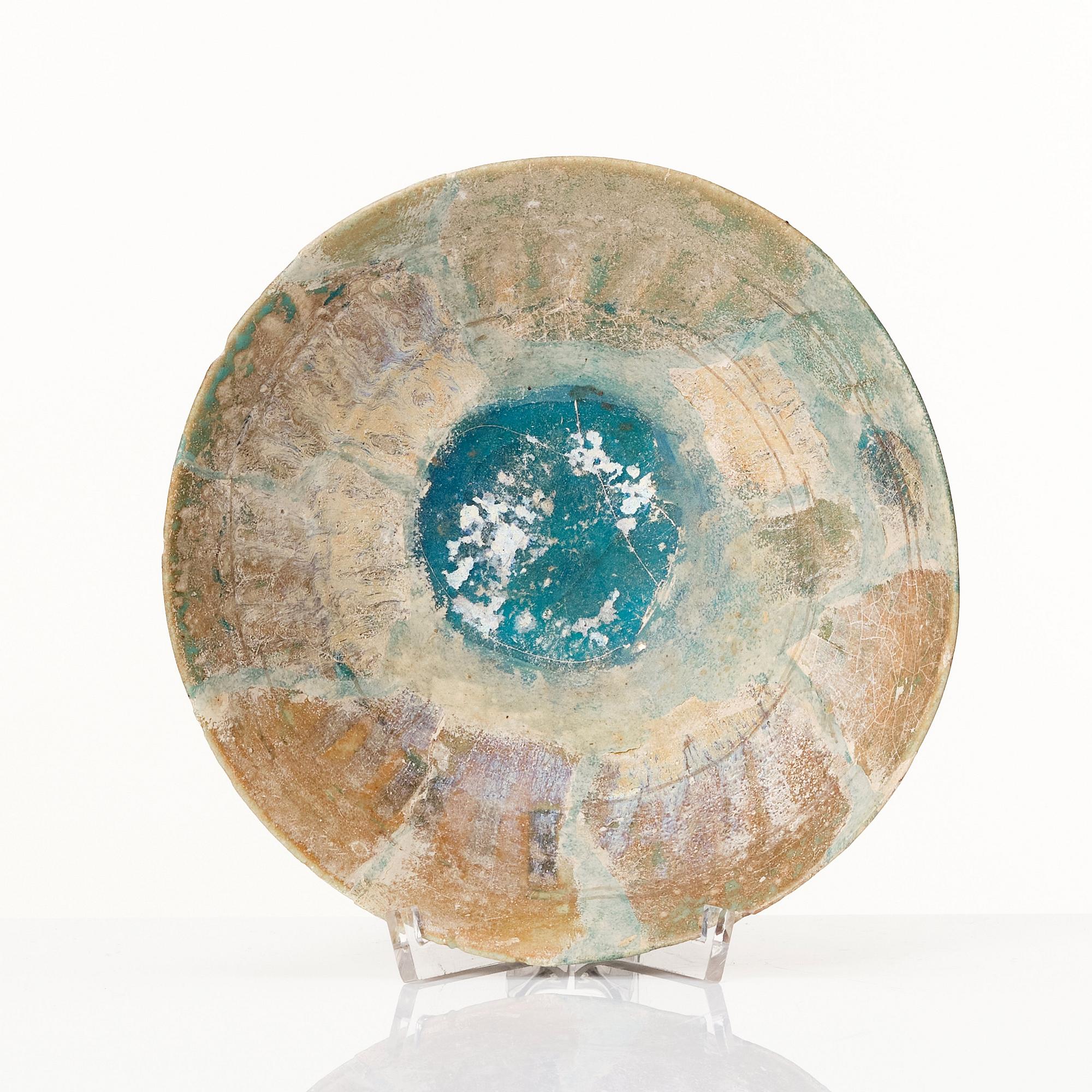A 10-11th century Kashan Turquoise-glazed pottery bowl.