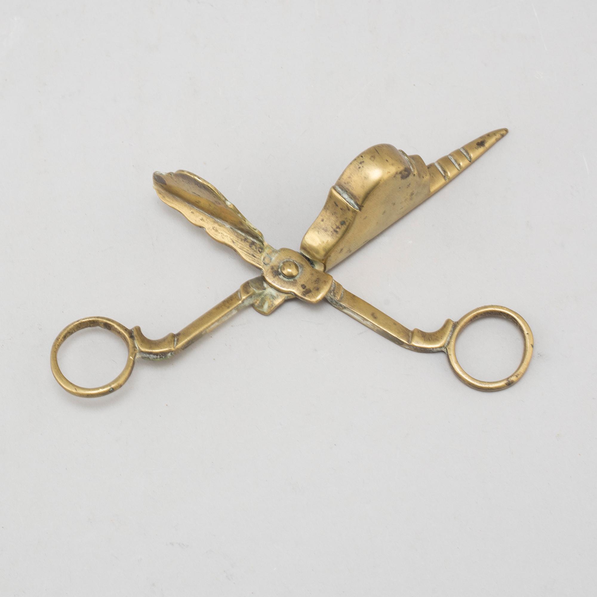 A 17th/18th century bronze candle scissors.