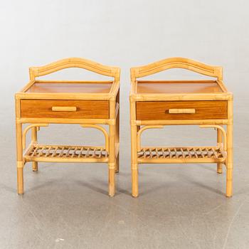 A pair of 1980s Dux rattan bedside tables.