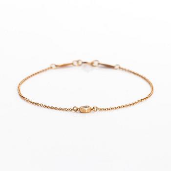 Tiffany & Co, Elsa Peretti, an 18K gold bracelet, 'Diamonds by the Yard', with a diamond approximately 0.08 ct.