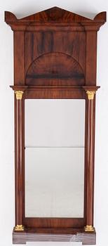 An Empire mirror and console table, first half of the 19th century.