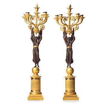 90. A pair of French  Empire five-light candelabra, sign. Rabiat, bronze maker in Paris 1756-1815.