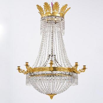 An French Empire eight-light gilt-brass and cut-glass chandelier.