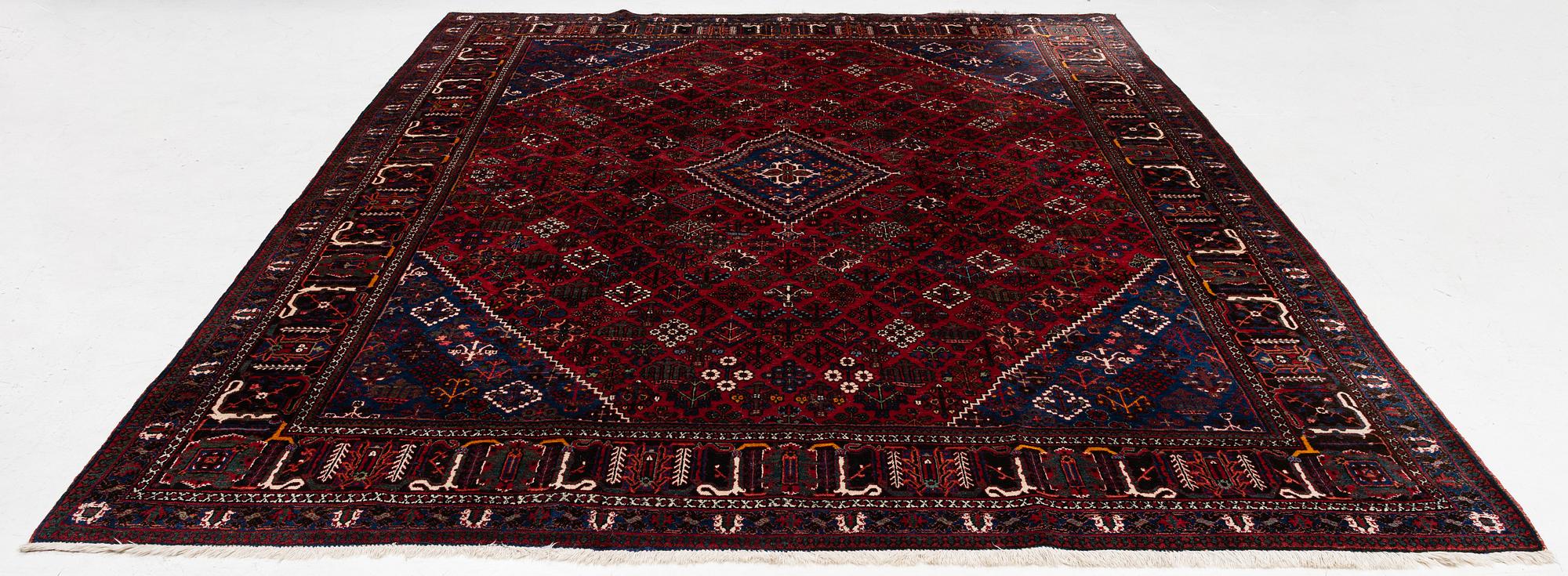 An oriental rug, c. 365 x 285 cm.