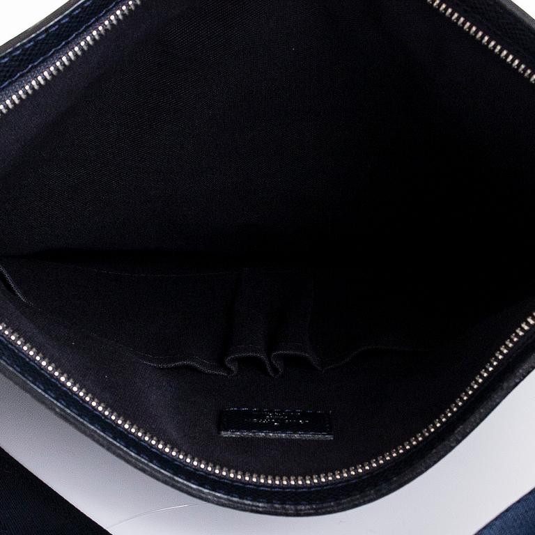 Louis Vuitton, a Navy Taiga 'Sasha' Messenger bag.