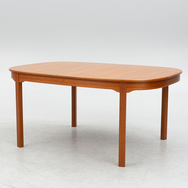 Carl Malmsten, a model "Ambassadör" dining table with ten chairs, Sweden, second half of the 20th century.