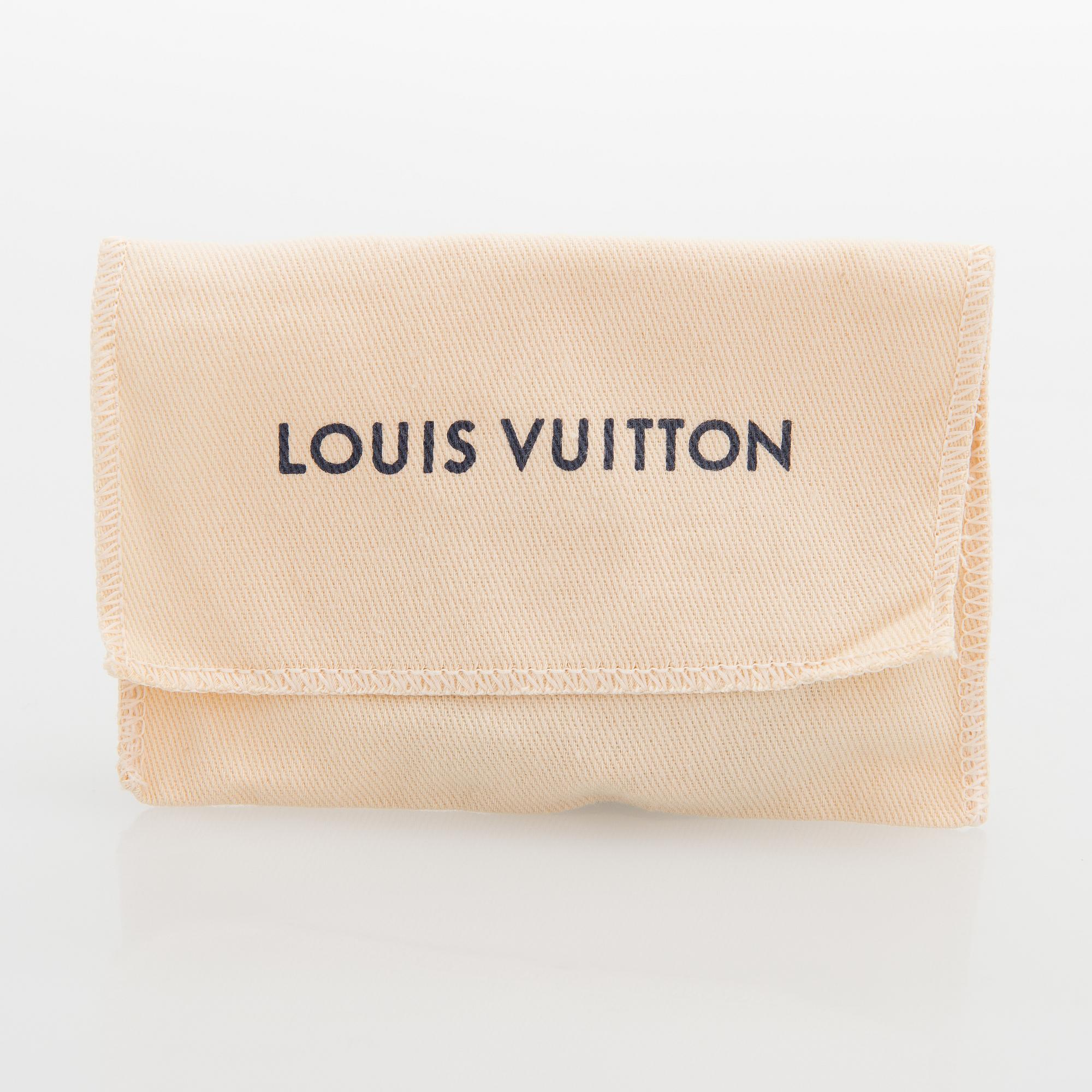 Louis Vuitton, "Fasten your LV" armband. Märkt Louis Vuitton Paris, Made in Spain.