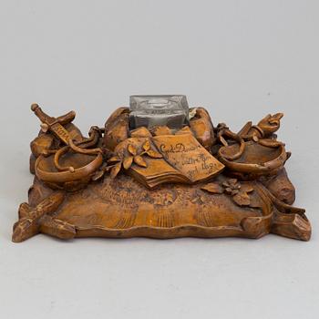 A CARVED WOOD INK STAND, dated 1859.