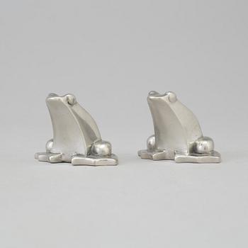 a pair of tin sculptures by Gunnar Cyrén.