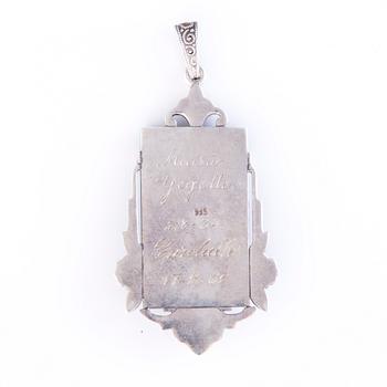 Four Art deco jewelry, ring, pendant necklace and earrings in silver.